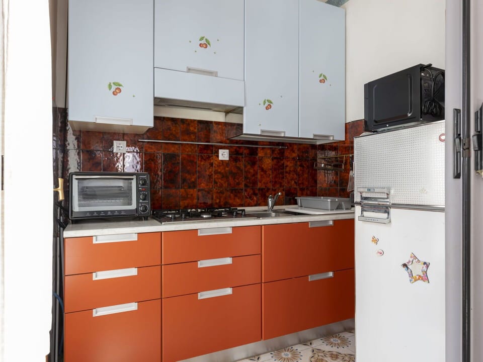 Cabinetry, Countertop, Building, Drawer, Kitchen, Kitchen Appliance, Wood, Kitchen Stove, Flooring, Floor
