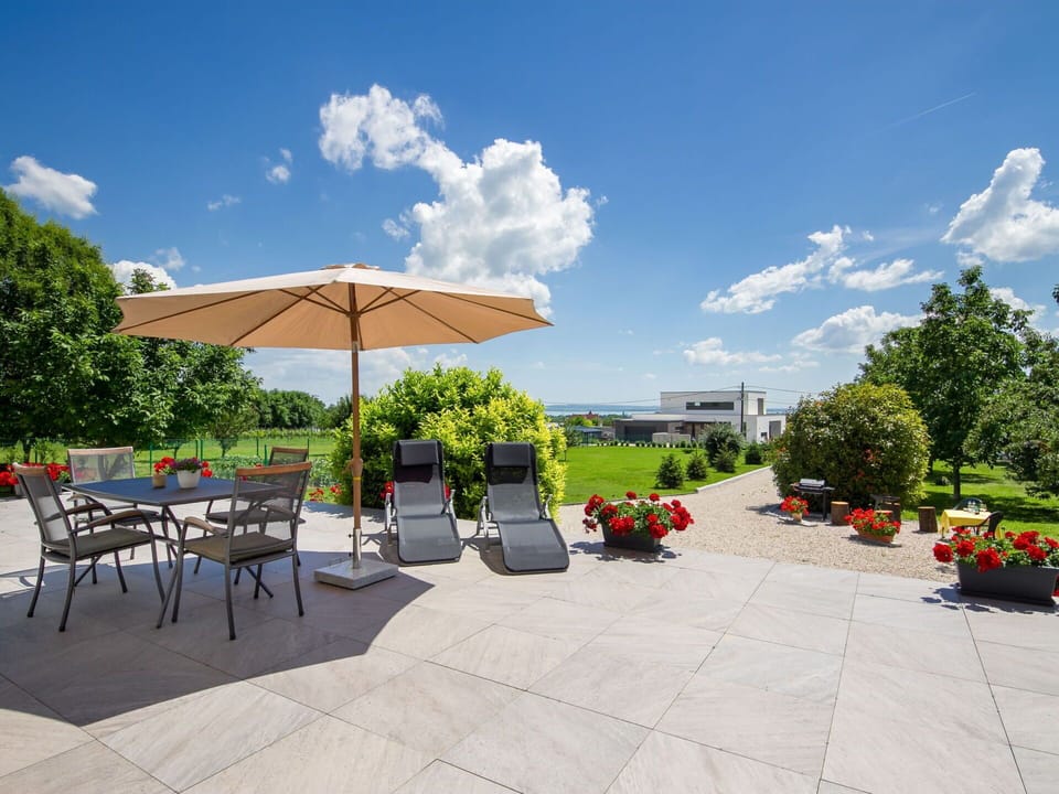 Cloud, Sky, Plant, Flowerpot, Shade, Outdoor Furniture, Chair, Urban Design, Tree, Landscape