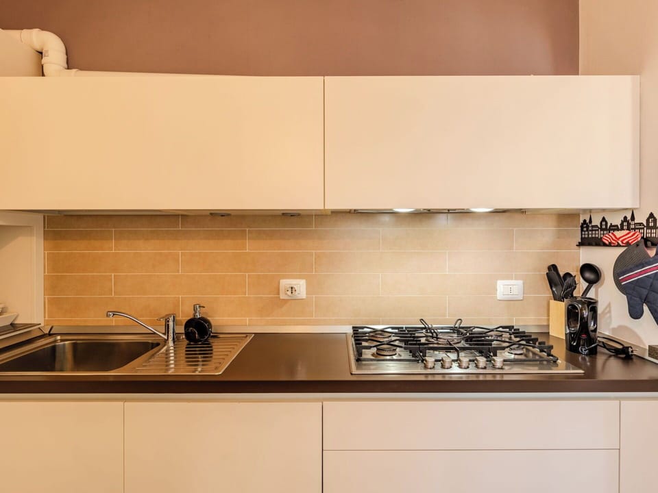 Kitchen, Countertop, Kitchen Appliance, Major Appliance, Interior Design, Cabinetry, Kitchen Stove, Stove, Flooring, Gas Stove