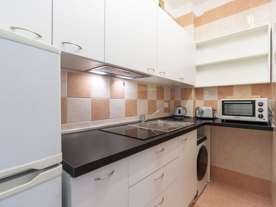 Cabinetry, Countertop, Wood, Building, Drawer, Kitchen, Flooring, Tap, Kitchen Appliance, Interior Design