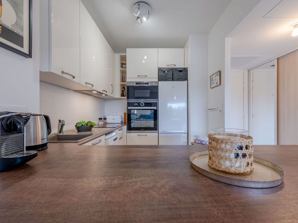 Property, Furniture, Cabinetry, Picture Frame, Countertop, Wood, Flooring, Interior Design, Building, Kitchen Appliance