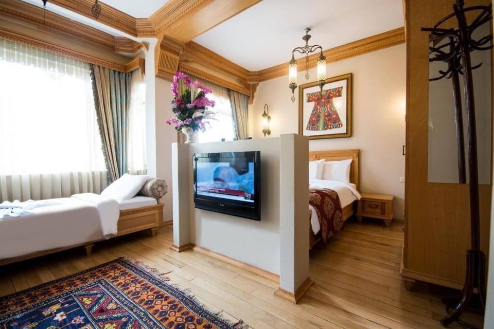 Deluxe Quadruple Room | Premium bedding, minibar, in-room safe, desk