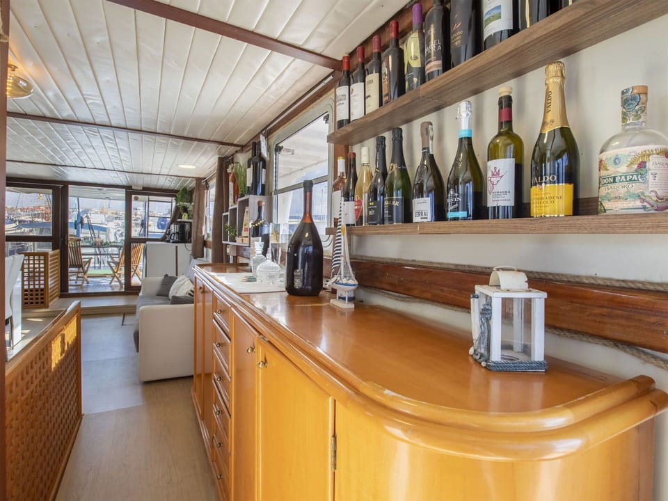Property, Cabinetry, Building, Furniture, Countertop, Bottle, Wood, Kitchen, Shelf, Interior Design