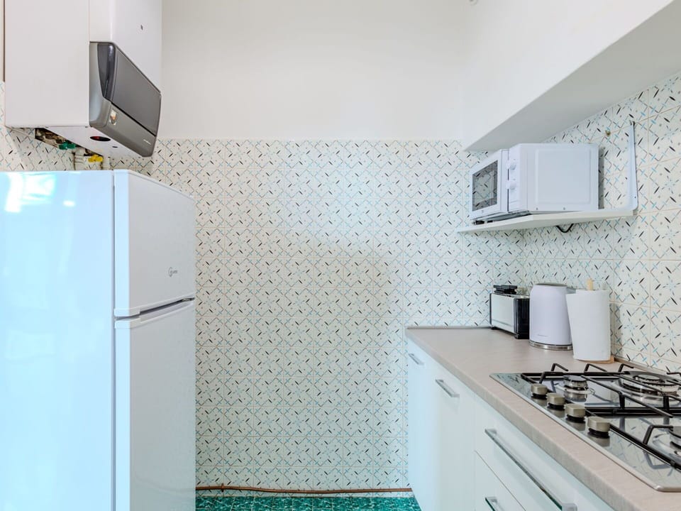 Cabinetry, Property, Countertop, Building, Kitchen Stove, Lighting, Gas Stove, Interior Design