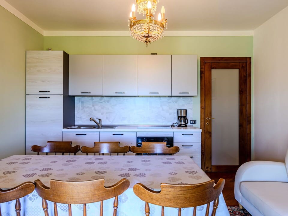 Table, Cabinetry, Property, Furniture, Countertop, Chair, Wood, Lighting, Interior Design, Kitchen