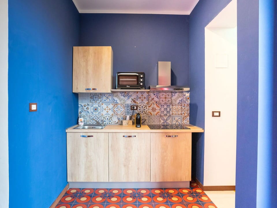 Cabinetry, Property, Blue, Purple, Countertop, Lighting, Wood, Flooring, Interior Design, Paint