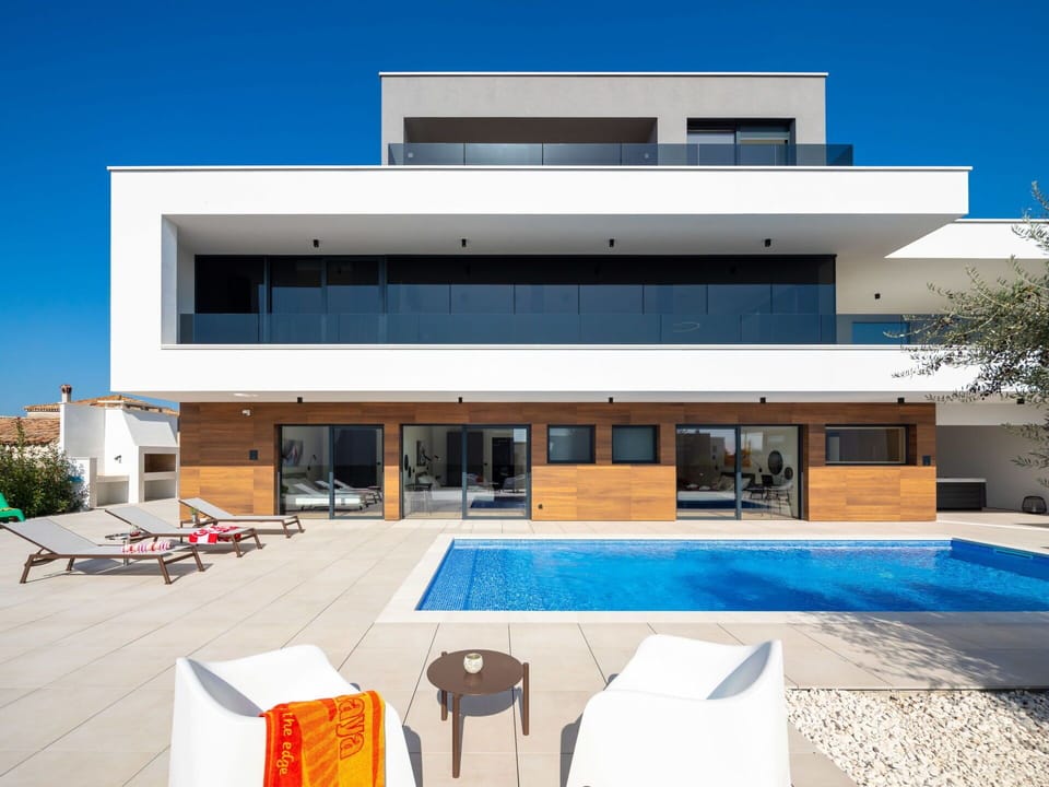 Building, Property, Sky, Window, Shade, House, Architecture, Interior Design, Urban Design, Door