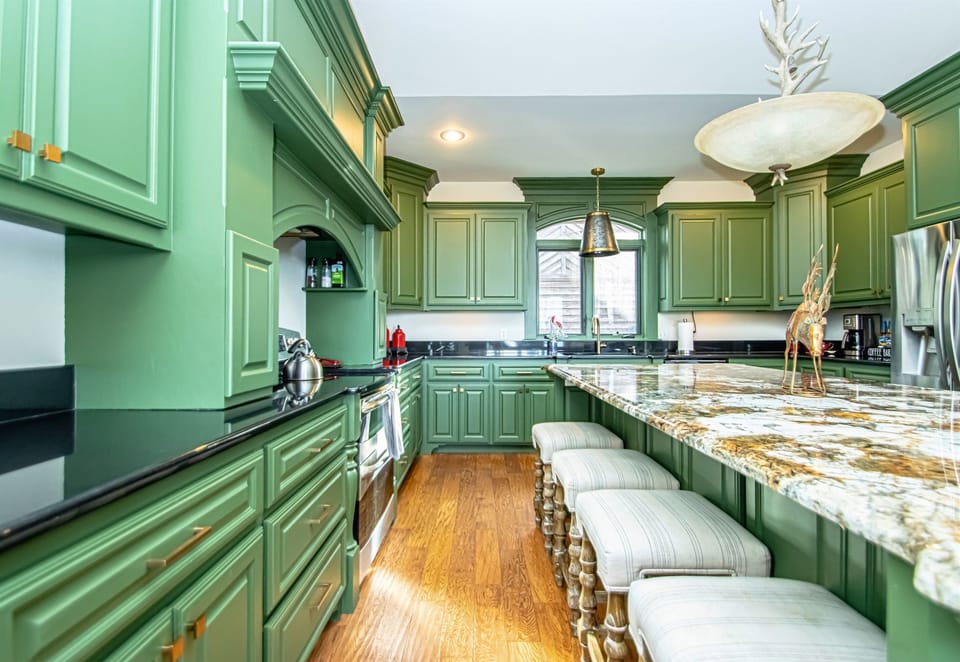 Take a Seat on One of the Barstools at the Island for a Quick Morning Bite