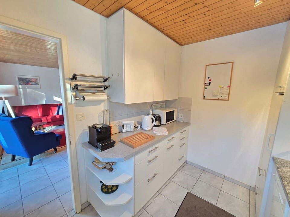 Flooring, Interior Design, Furniture, Floor, Countertop, Cabinetry, Kitchen, Room, Major Appliance, Kitchen Appliance