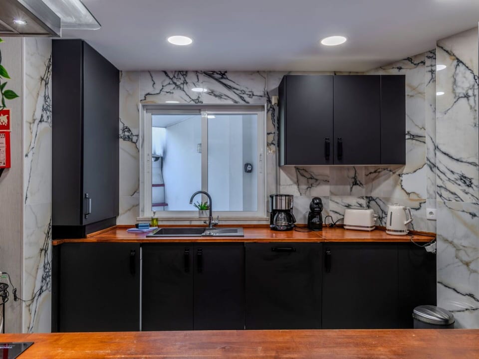 Kitchen, Countertop, Interior Design, Furniture, Kitchen Appliance, Major Appliance, Wood, Cabinetry, Flooring, Lighting