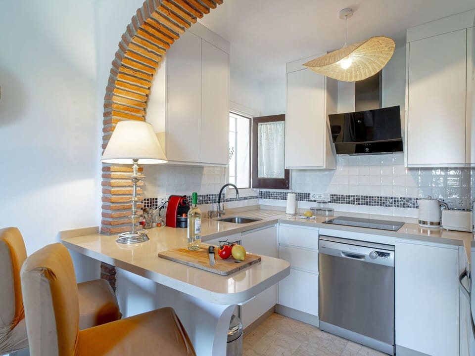 Cabinetry, Countertop, Property, Furniture, Sink, Kitchen Stove, Kitchen, Interior Design, Tap, Kitchen Appliance