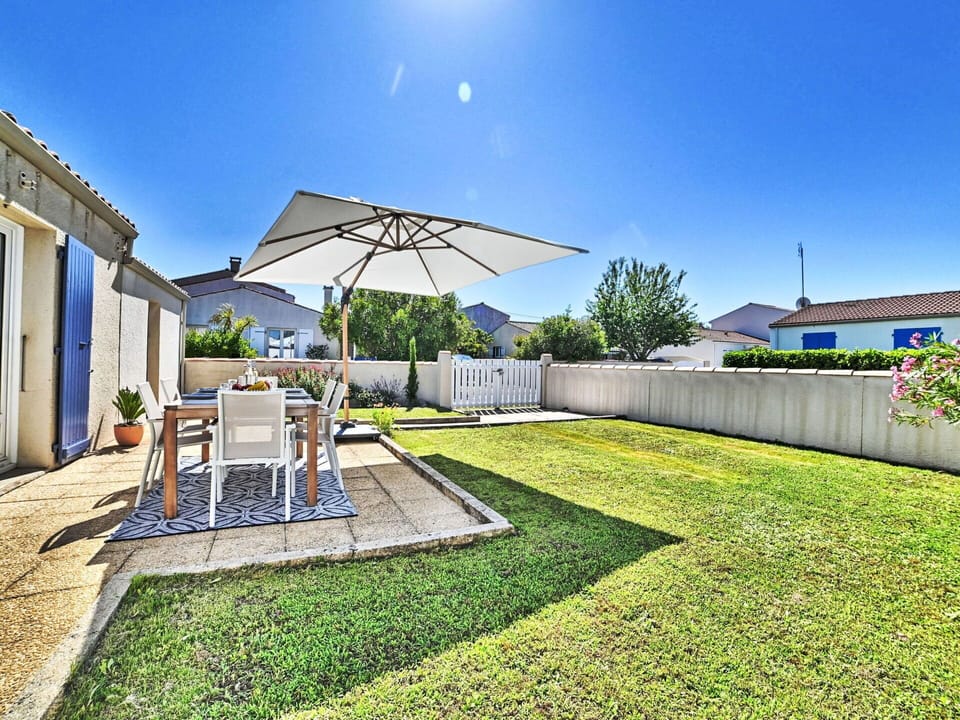 Sky, Plant, Building, Shade, Land Lot, Grass, Chair, Outdoor Furniture, Urban Design, Tree