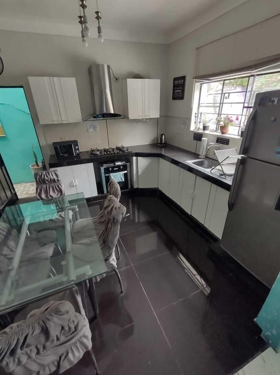 Shared fridge, shared microwave, blender, cookware/dishes/utensils