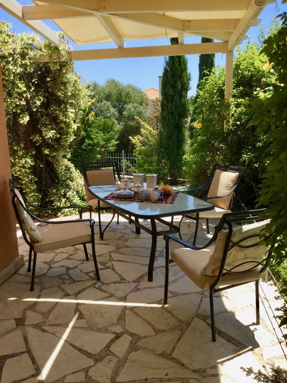 Outdoor eating area with shade to protect from the hot Greek sun