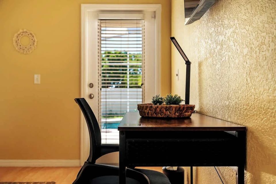 Inspire your productivity in our cozy desk nook with a view, blending tranquility with the comforts of home.