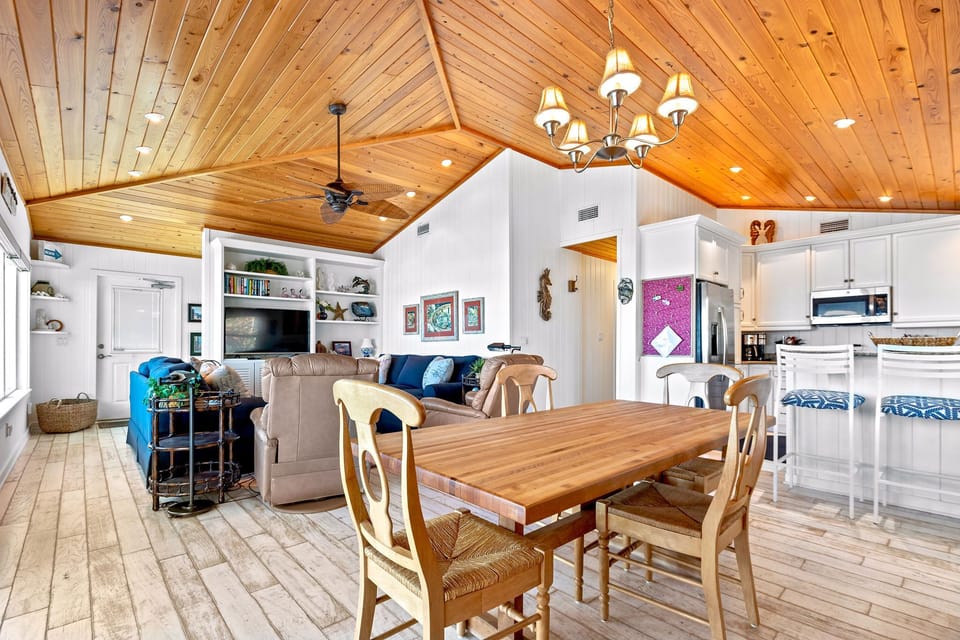 Dining, living, and kitchen areas.