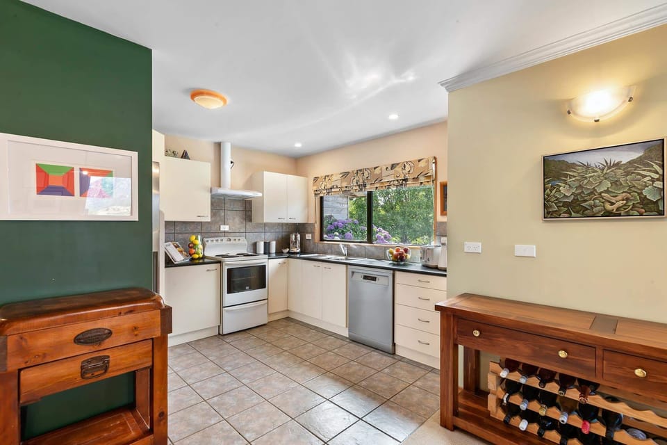 Kitchen: Contemporary design with stylish appliances and garden views, perfect for culinary adventures!