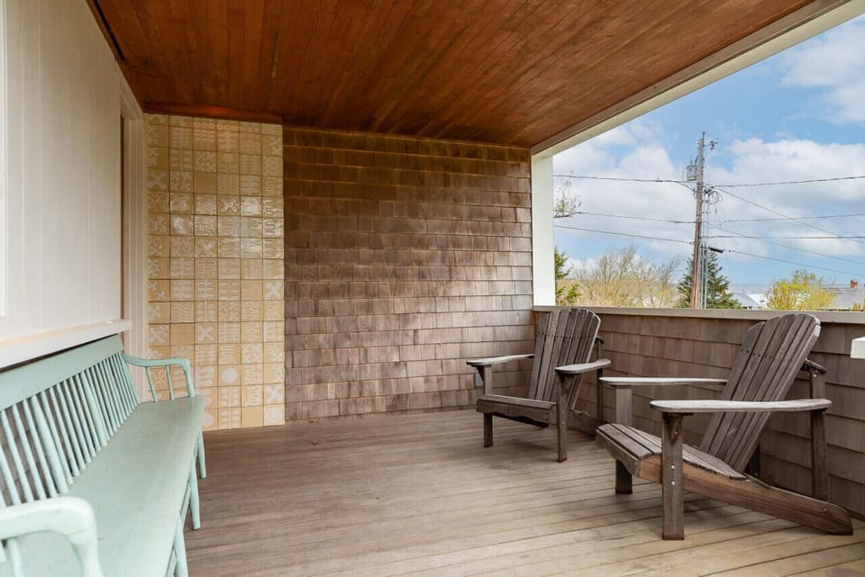 Entrance to the home with a small covered porch