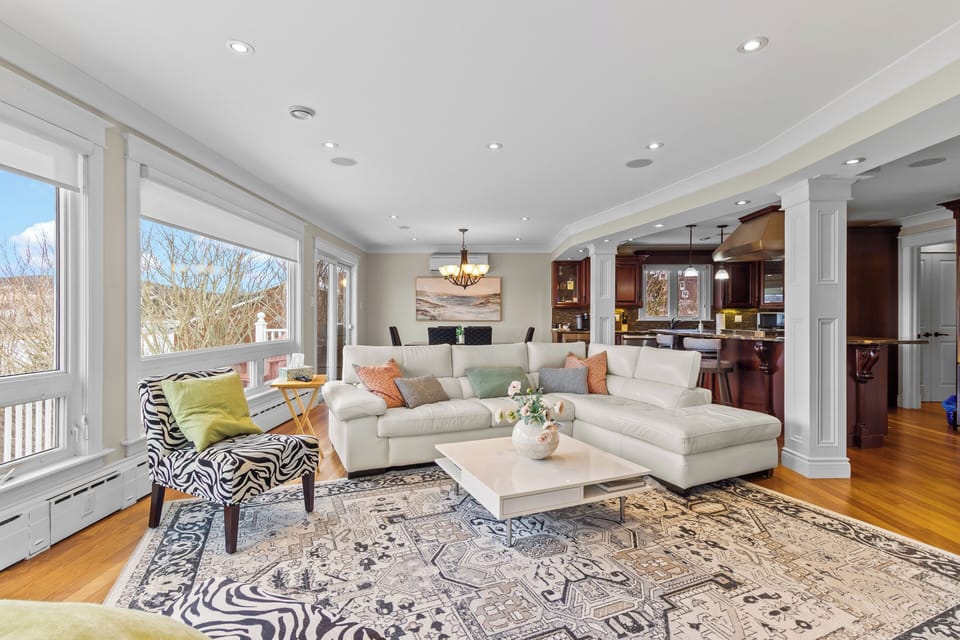 Bright and inviting living room with scenic views and comfortable seating.