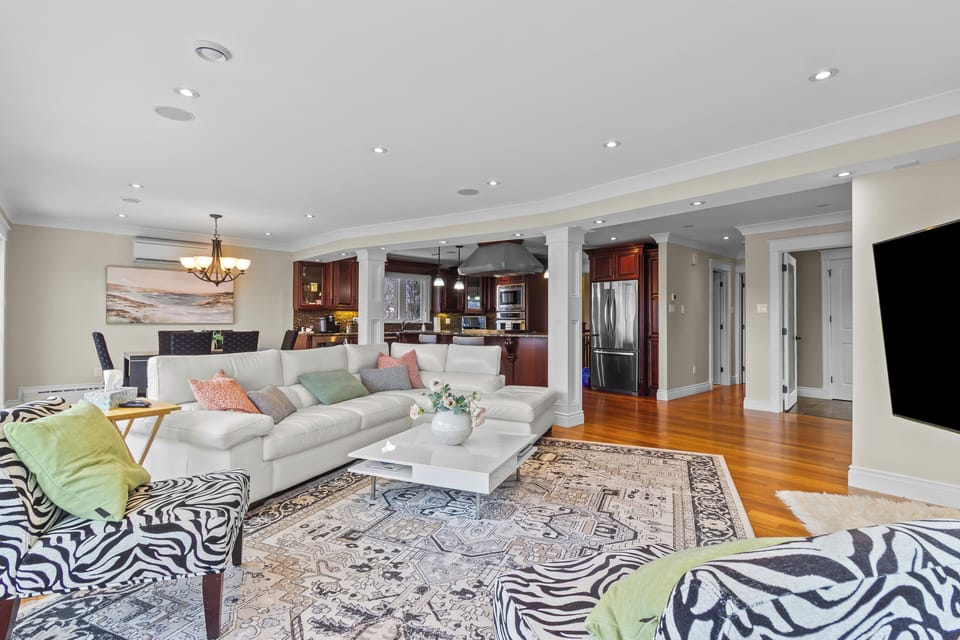 Open living space with cozy seating and seamless flow to kitchen.