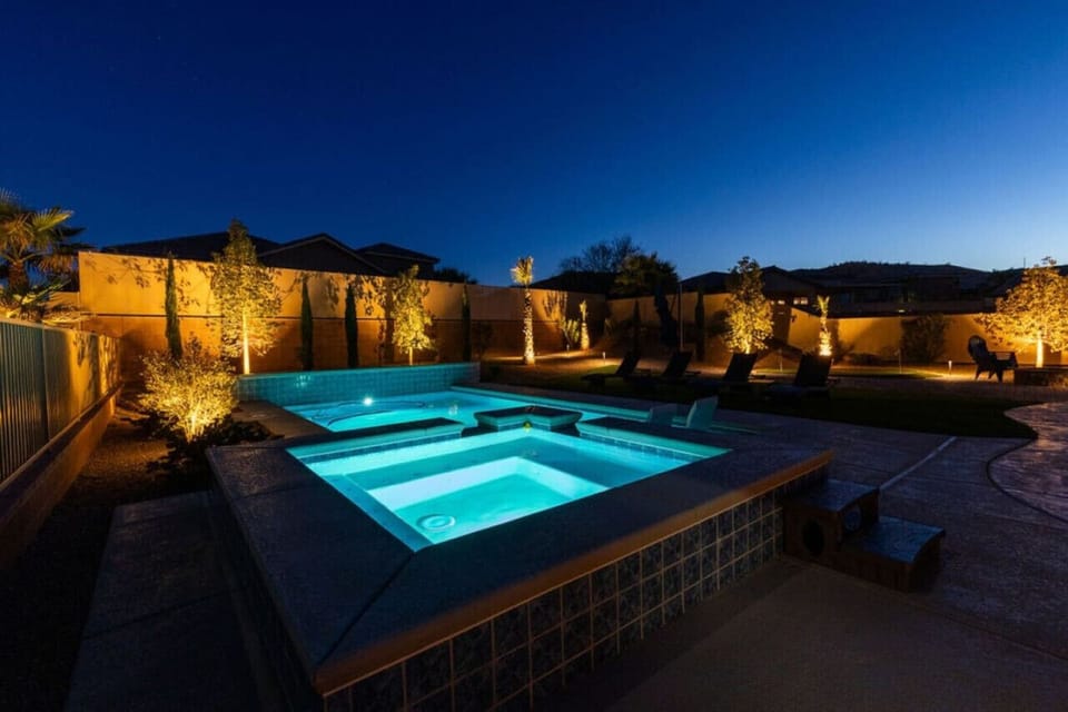 Stunning yard with pool and hot tub.