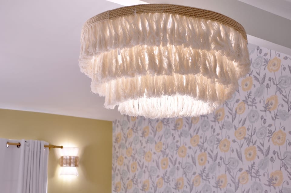 This stunning tassel chandelier brings a touch of boho elegance and warmth to the room. Perfect for creating a cozy, inviting atmosphere that captures the spirit of Palm Springs style.