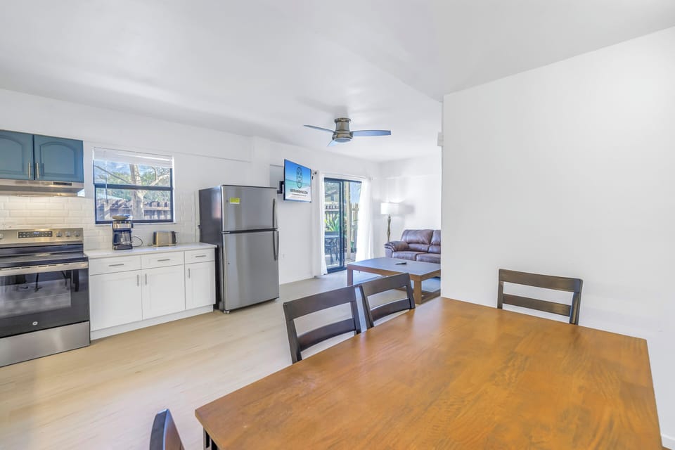 Newly updated open-plan living and dining space with modern finishes at The Coral Cabanas, Siesta Key 2BR.