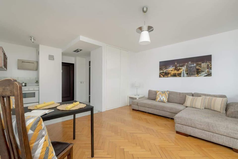 A different perspective of the living room, emphasizing the spaciousness and elegant neutral tones.


