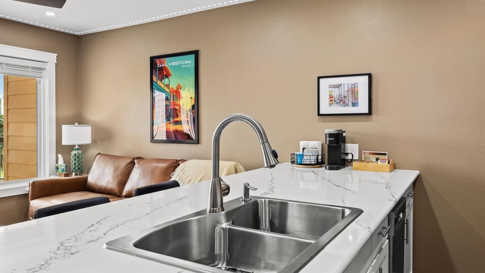 Beautiful quarts counters with large double sink.
