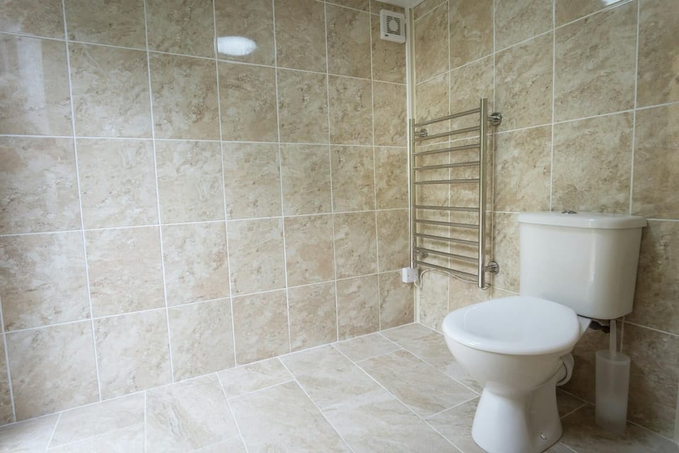 Shower room with shower, heated towel rail, toilet