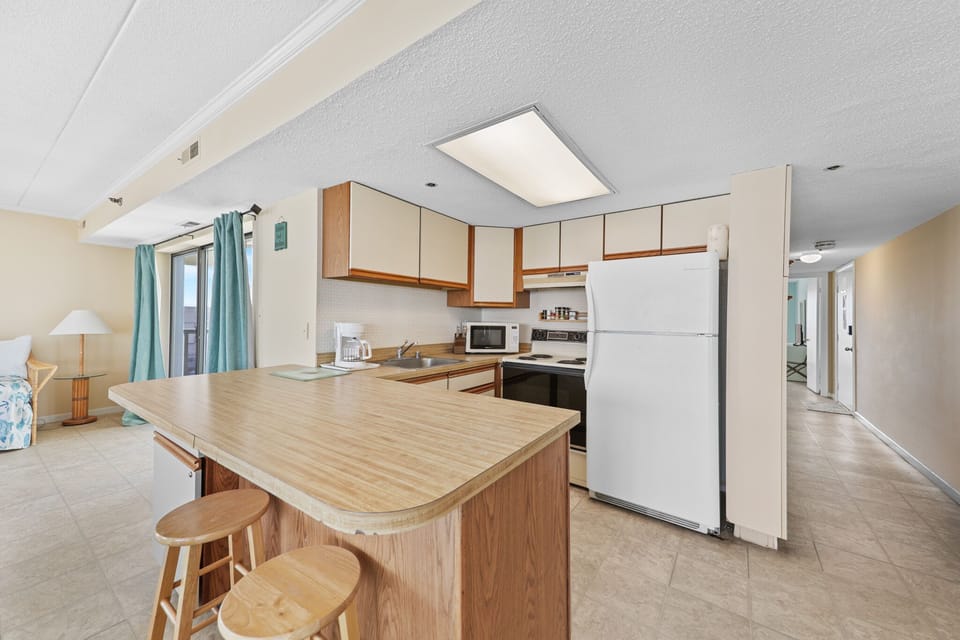 The Spacious Kitchen offers all the Conveniences of Home right at your fingertips.