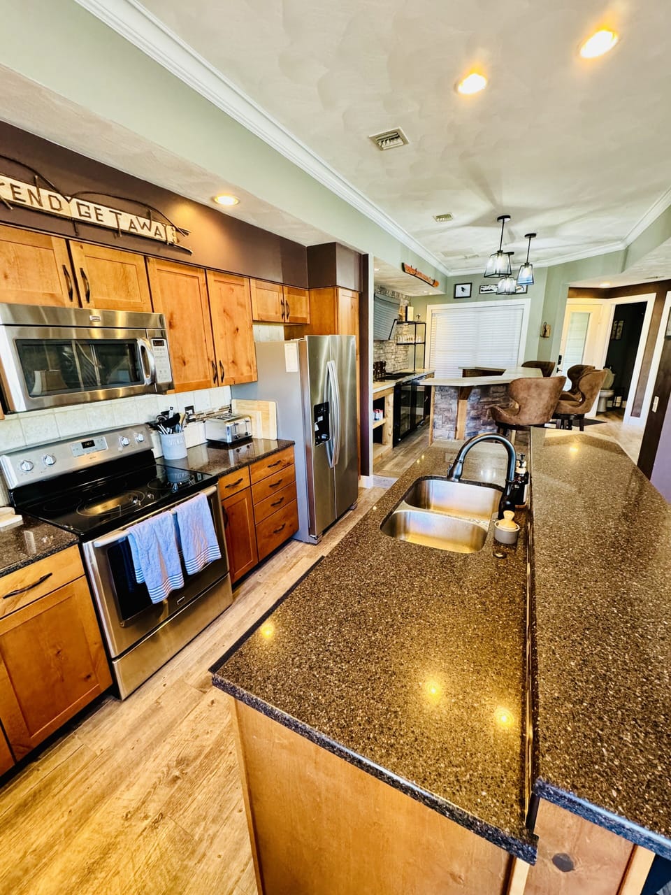 The kitchen and bar flow nicely into one another