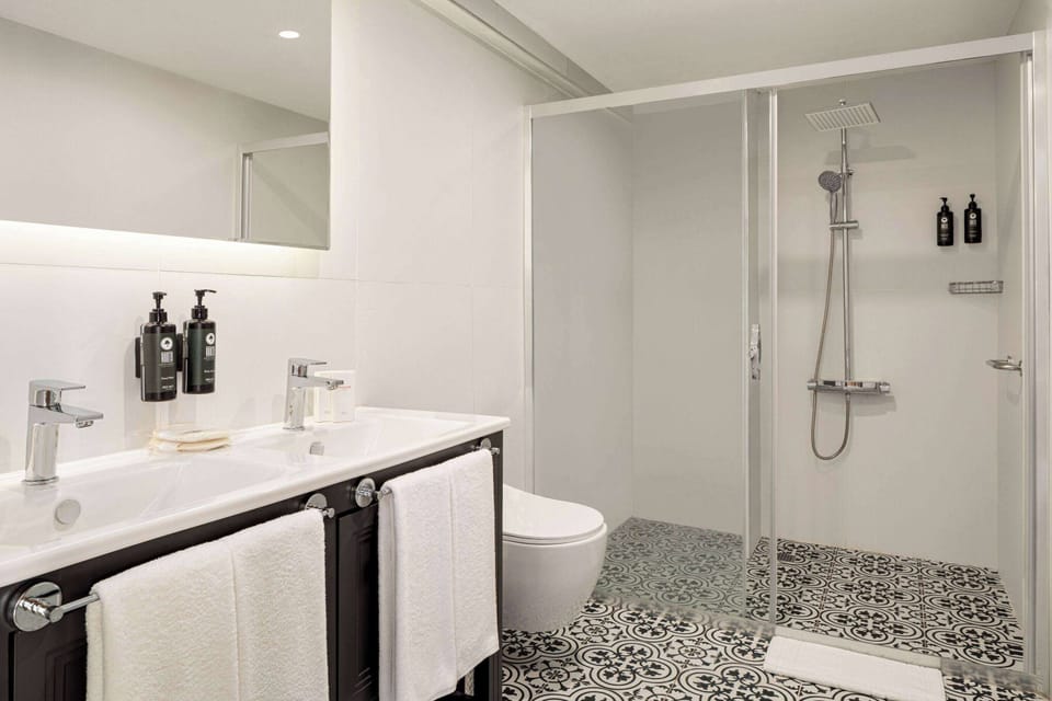 Shower, hair dryer, slippers, towels