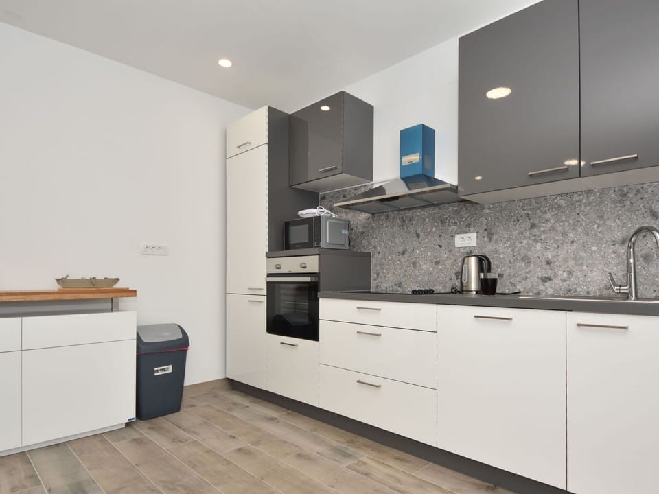 Cabinetry, Property, Countertop, Kitchen, Wood, Kitchen Stove, Interior Design, Building, Flooring, Floor