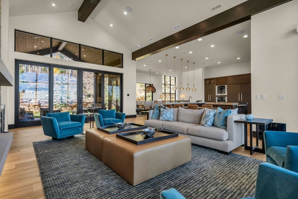 Sofa, Accent Chairs, Coffee Tables, and Sliding Doors to the Pool Area