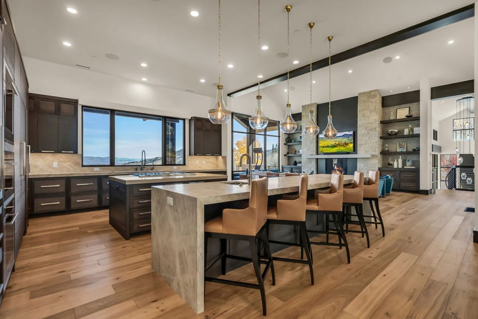 Kitchen with Island, Breakfast Bar Table, Chairs, and TV