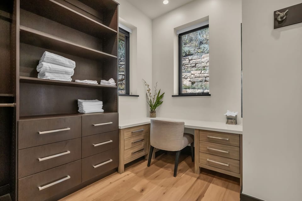 Work Area with Shelfs, Drawers, and a Desk and Chair