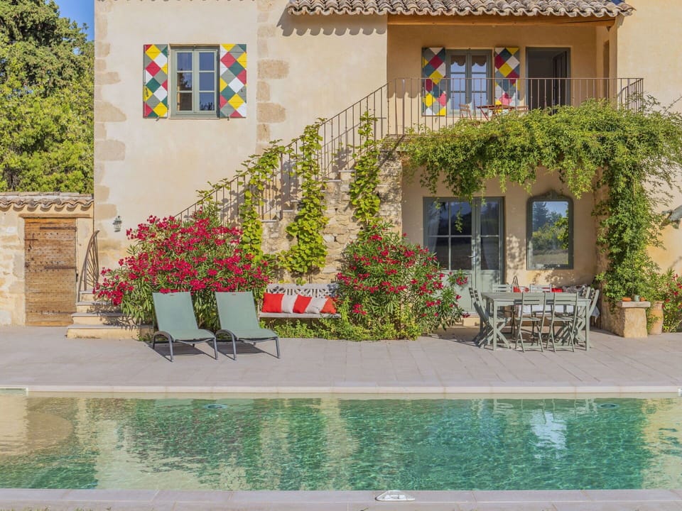 Flower, Plant, Building, Water, Furniture, Property, Window, Flowerpot, Chair, Door