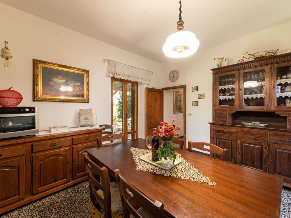 Brown, Cabinetry, Furniture, Property, Table, Picture Frame, Wood, Drawer, Flower, Interior Design