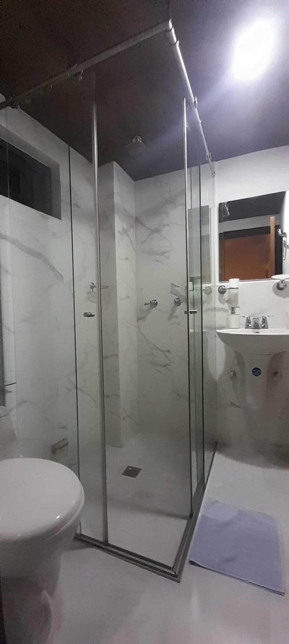 Rainfall showerhead, towels, soap, shampoo