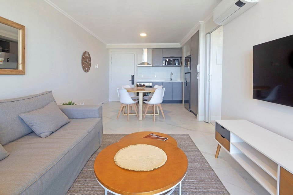 Apartment | Living area | 50-inch Smart TV with satellite channels