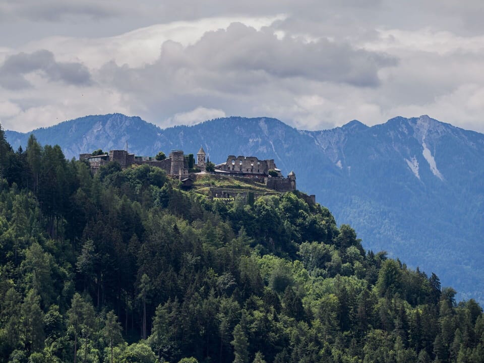 Cloud, Mountain, Sky, Building, Ecoregion, Natural Landscape, Tree, Highland, Vegetation, Atmospheric Phenomenon