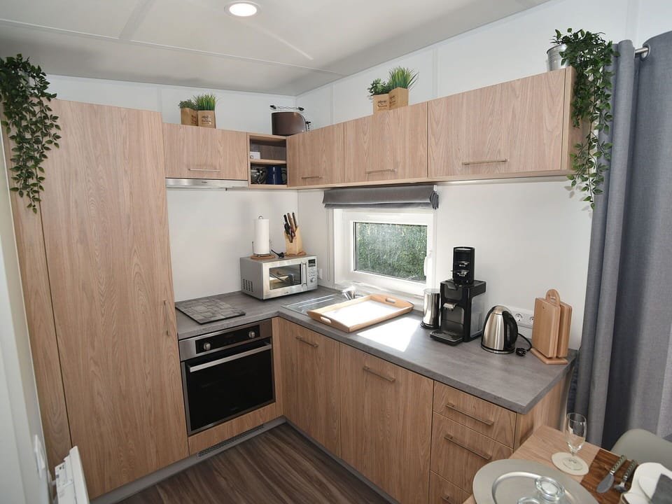 Cabinetry, Countertop, Property, Furniture, Kitchen Appliance, Wood, Kitchen, Kitchen Stove, Lighting, Home Appliance