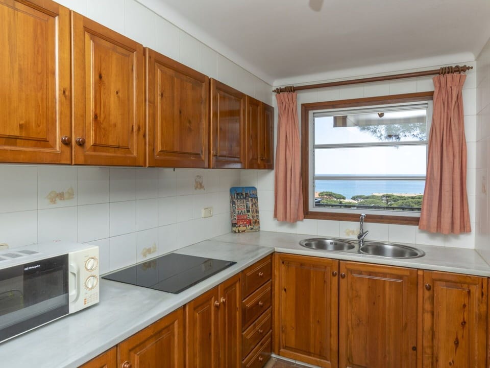 Kitchen, Cabinetry, Flooring, Wood, Countertop, Kitchen Appliance, Kitchen Sink, Floor, Major Appliance, Interior Design
