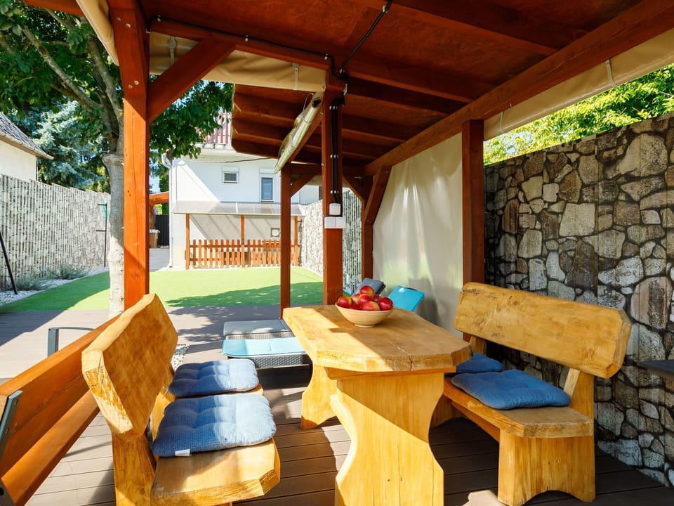 Sky, Building, Property, Table, Furniture, Cloud, Mountain, Interior Design, Outdoor Furniture, Wood