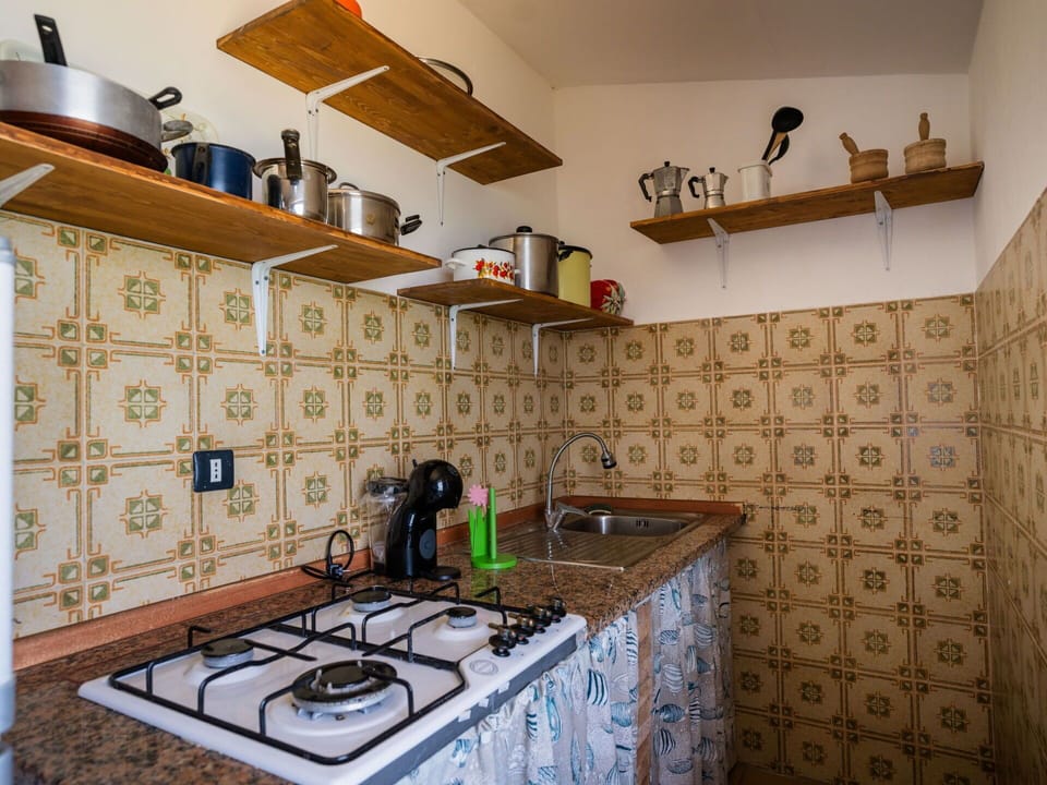 Cabinetry, Countertop, Property, Sink, Kitchen, Gas Stove, Kitchen Appliance, Kitchen Stove, Lighting, Interior Design