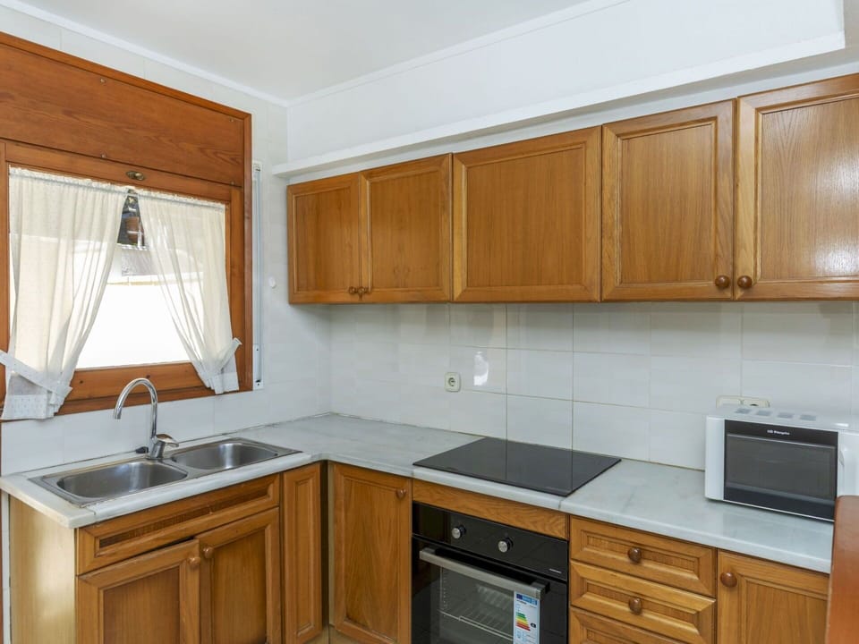 Kitchen, Cabinetry, Kitchen Appliance, Countertop, Flooring, Major Appliance, Wood, Furniture, Floor, Interior Design