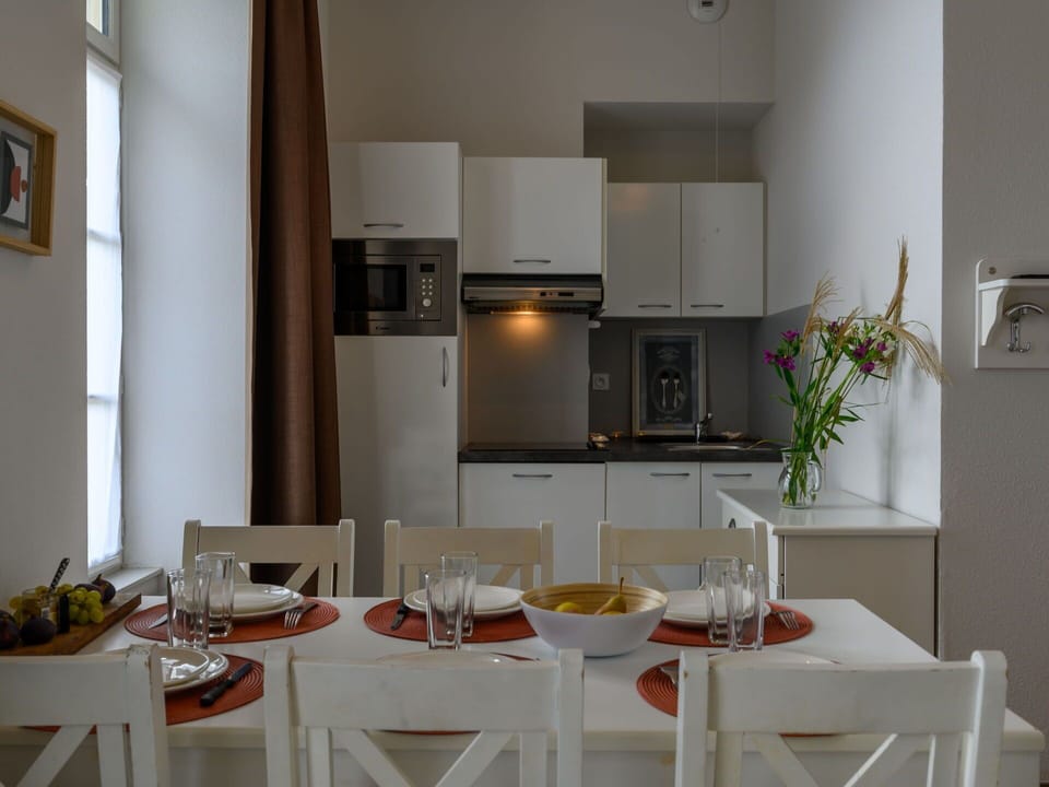 Table, Property, Furniture, Cabinetry, Tableware, Wood, Interior Design, Dishware, Chair, Kitchen