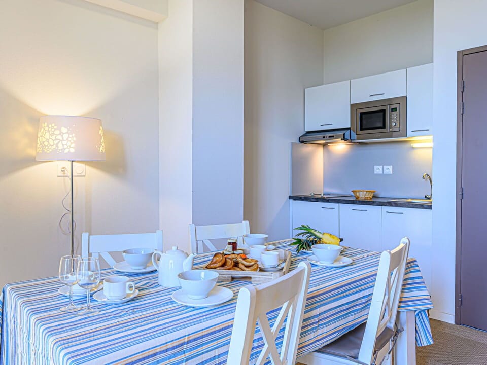 Property, Furniture, Blue, Tableware, Azure, Table, Lighting, Tablecloth, Interior Design, Floor