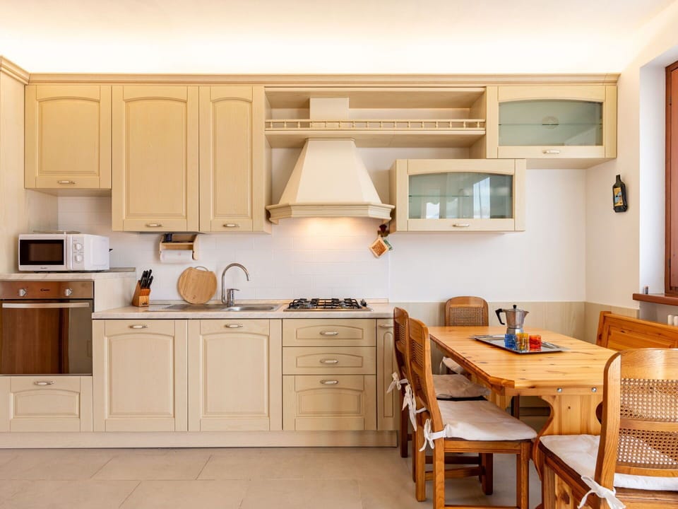 Cabinetry, Countertop, Furniture, Property, Kitchen, Chair, Drawer, Kitchen Stove, Wood, Interior Design